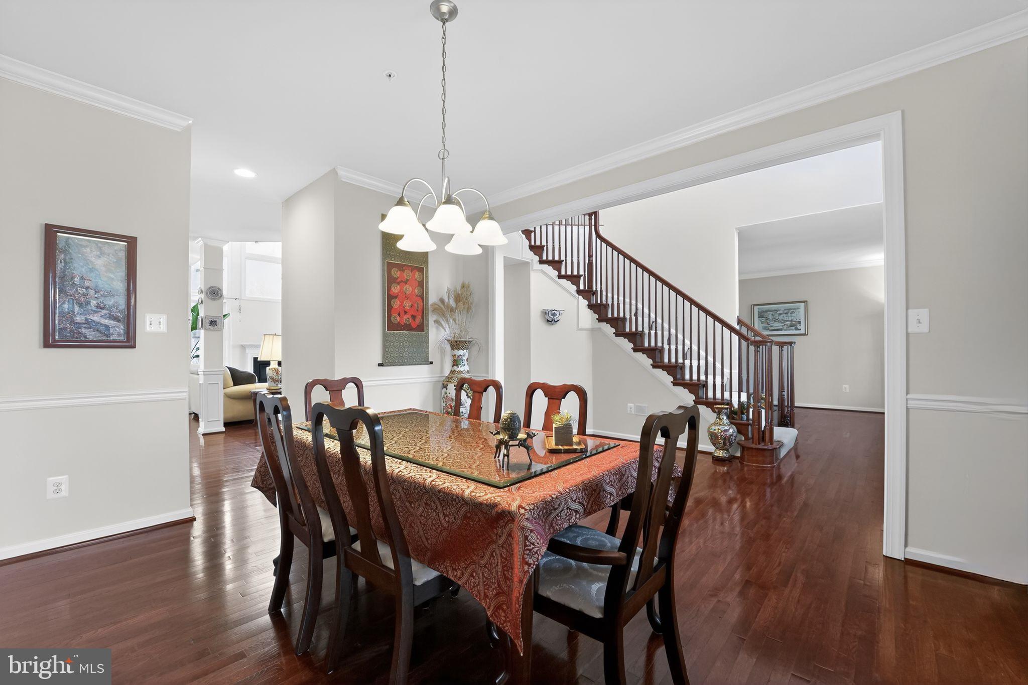 12039 Open Run Road Ellicott City, MD 21042 - Photo 9 of 67 Elegant dining space with staircase charm.