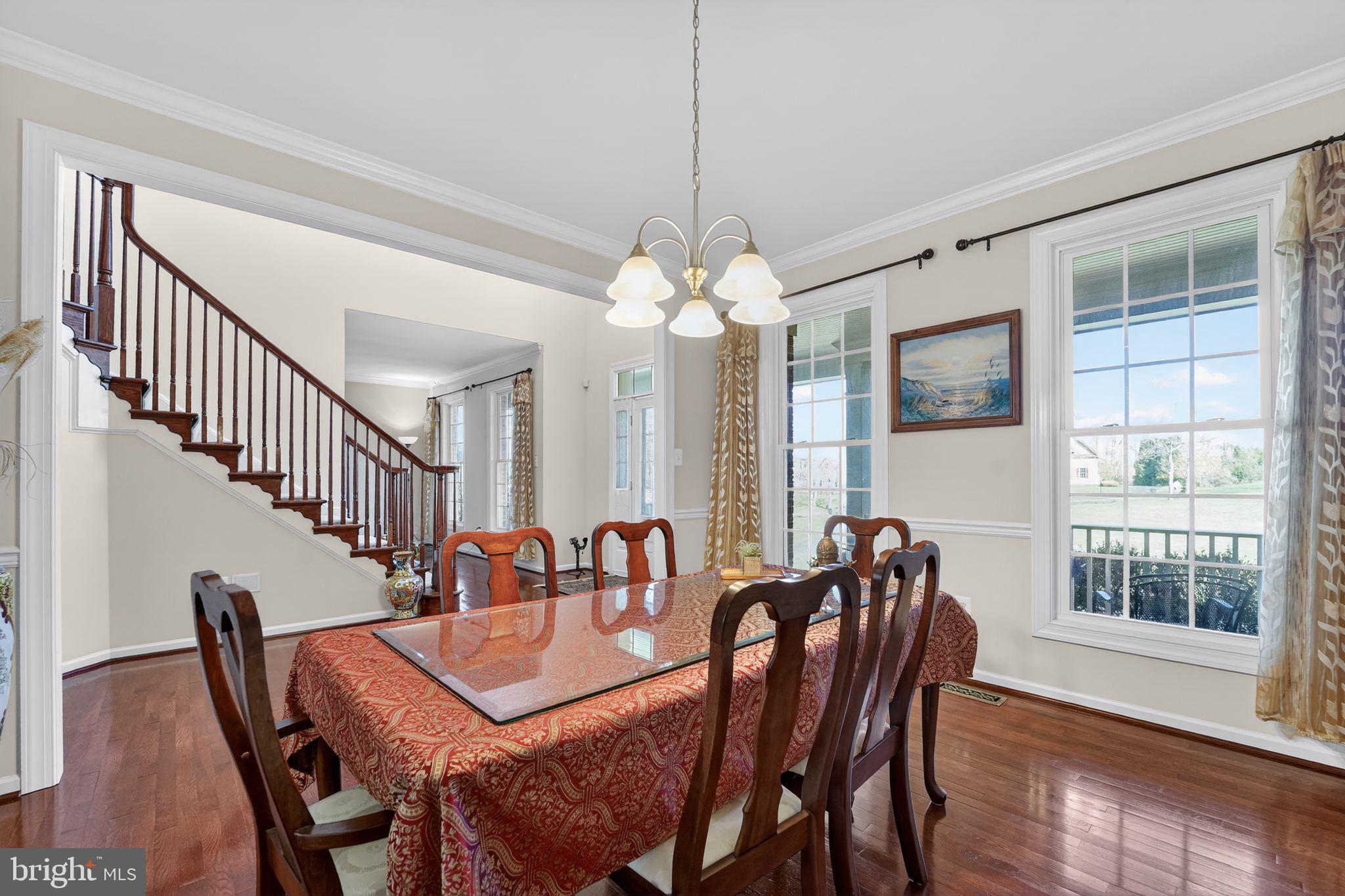 12039 Open Run Road Ellicott City, MD 21042 - Photo 10 of 67 Elegant dining space with staircase charm.