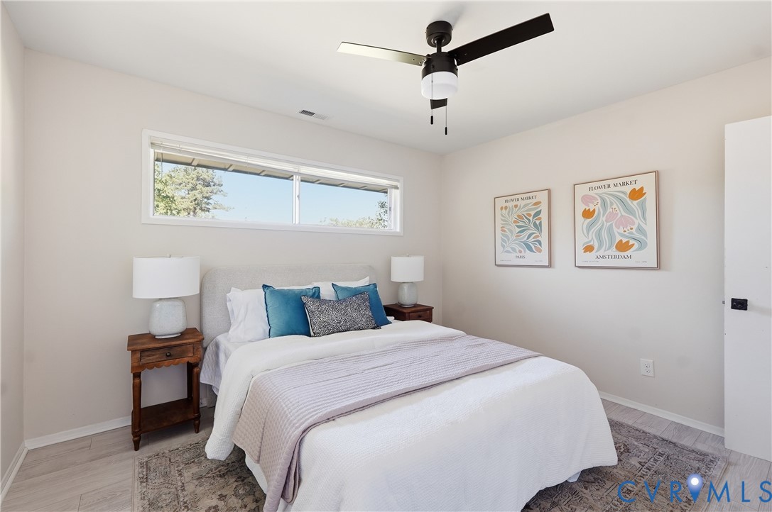 9207 Mapleway Road Richmond, VA 23229 - Photo 23 of 36 Light wood-finish flooring, a ceiling fan with lig