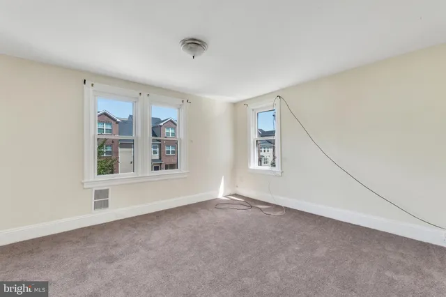 an empty room with windows