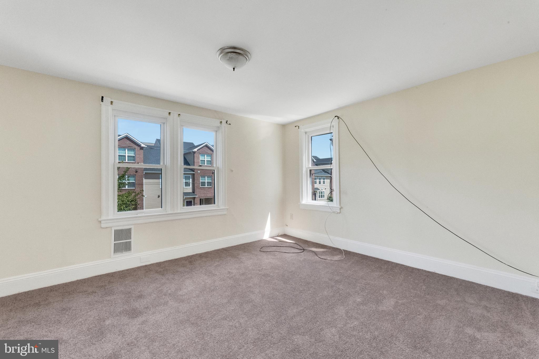 114 Delaware Avenue Riverside, NJ 08075 - Photo 11 of 21 a view of an empty room with a window