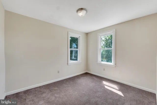 a bathroom with a tub and a sink