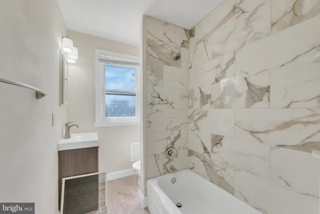 an empty room with a workbench and window