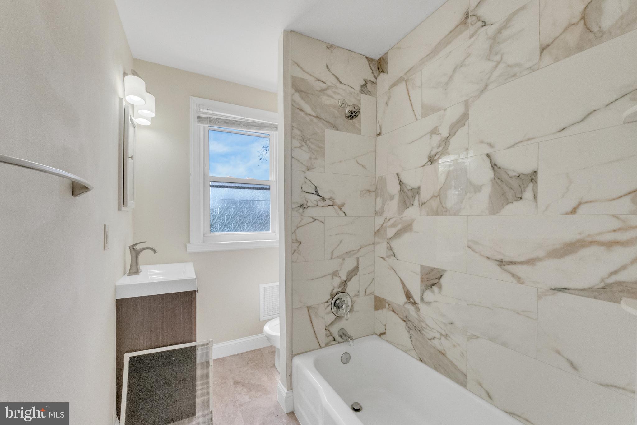 114 Delaware Avenue Riverside, NJ 08075 - Photo 14 of 21 a bathroom with a tub and a sink