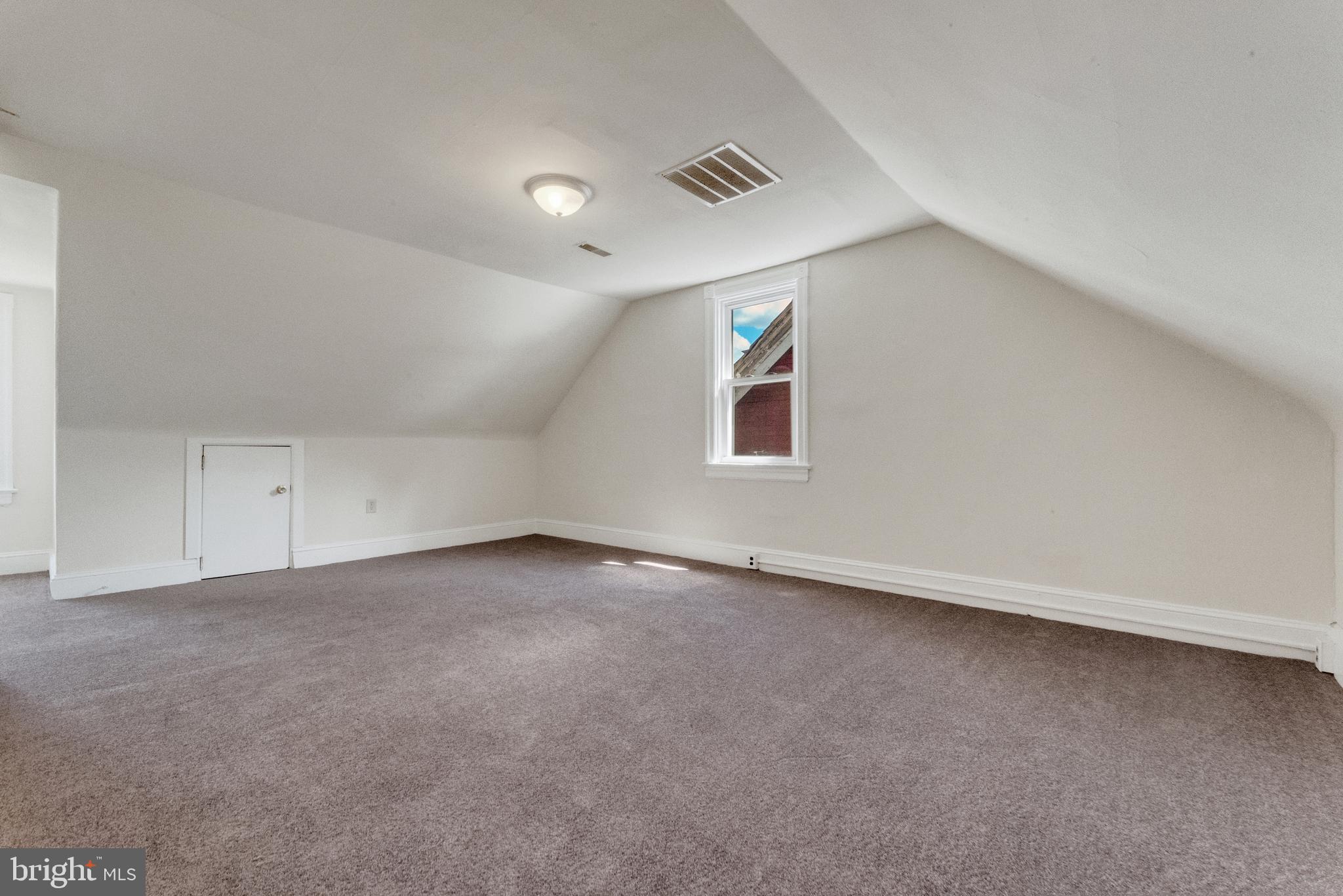 114 Delaware Avenue Riverside, NJ 08075 - Photo 16 of 21 an empty room with a workbench and window