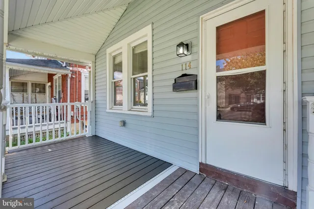 a view of a house with wooden deck