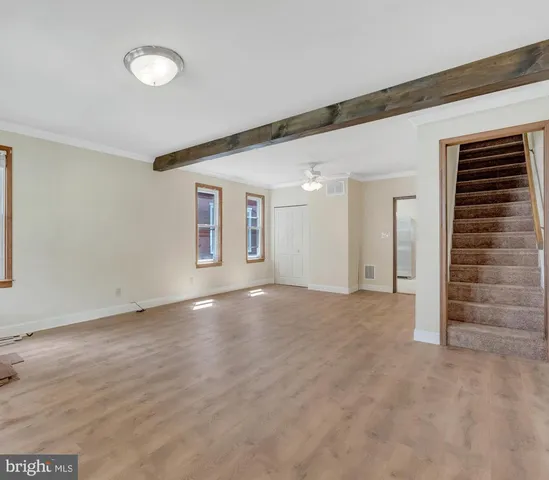 a view of an empty room with a window