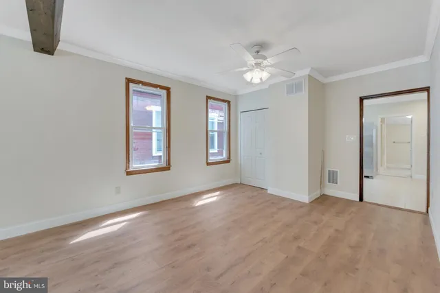 a kitchen with granite countertop a sink stainless steel appliances and cabinets