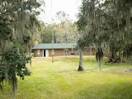 1562 Bay Grove Road Freeport, FL 32439 - Photo 13 of 18 a backyard of a house with table and chairs