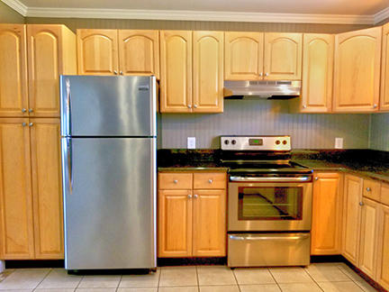 1562 Bay Grove Road Freeport, FL 32439 - Photo 3 of 18 a white refrigerator freezer and a stove sitting inside of a kitchen