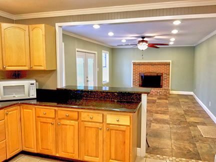 1562 Bay Grove Road Freeport, FL 32439 - Photo 7 of 18 a kitchen with stainless steel appliances granite countertop a stove a sink and a microwave