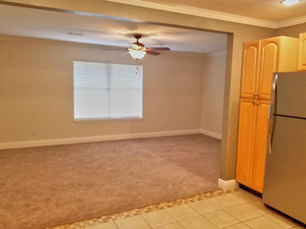 1562 Bay Grove Road Freeport, FL 32439 - Photo 8 of 18 en empty room with windows and refrigerator