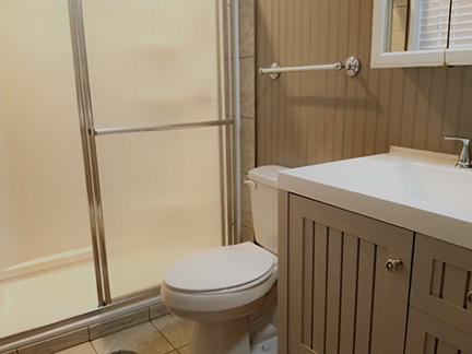 1562 Bay Grove Road Freeport, FL 32439 - Photo 9 of 18 a bathroom with a sink a toilet and shower