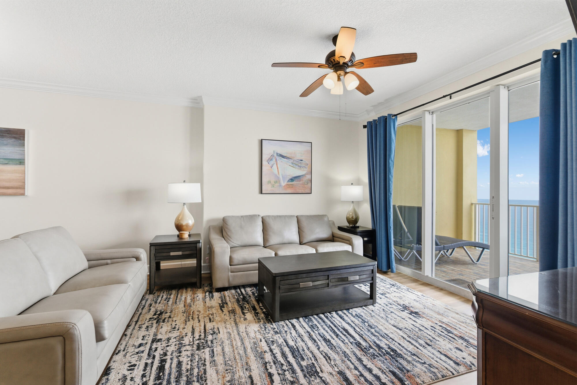17643 Front Beach Road, Unit 1806 Panama City Beach, FL 32413 - Photo 3 of 25 a living room with furniture and a wooden floor