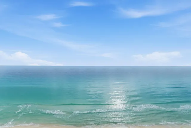 a bedroom with a bed and a flat tv screen on dresser