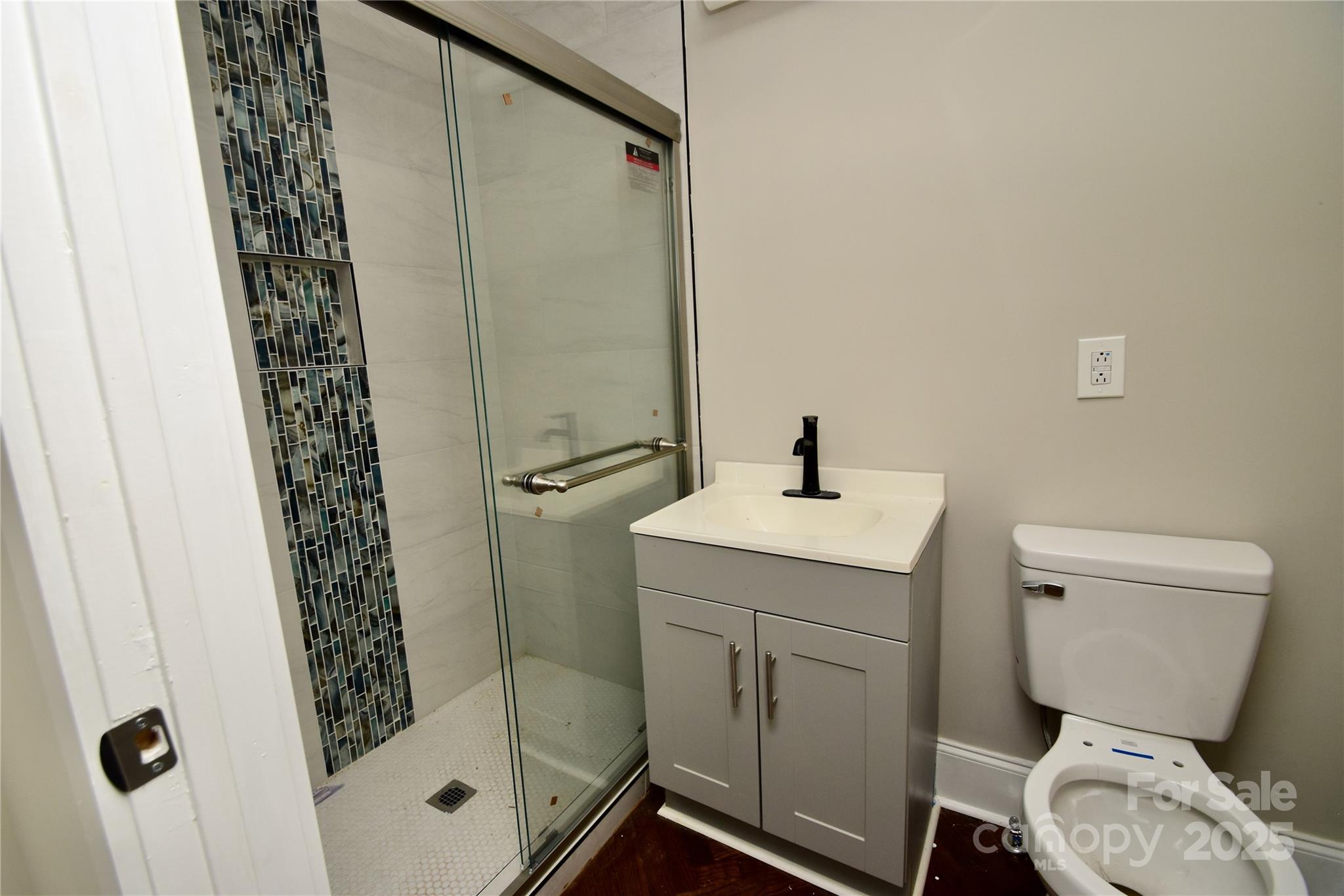506 East Ridge Street Kings Mountain, NC 28086 - Photo 13 of 23 a bathroom with a sink toilet and shower
