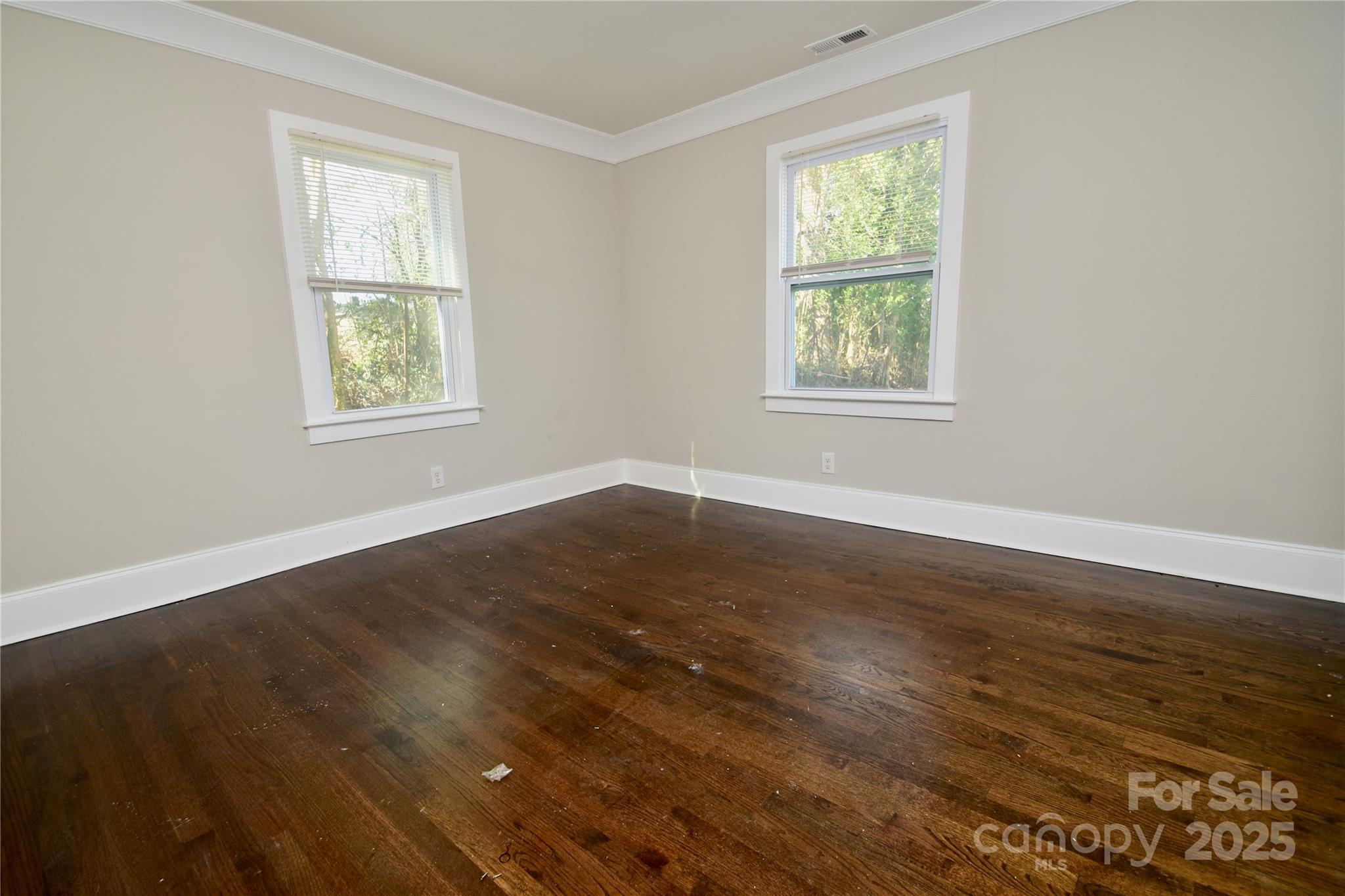 506 East Ridge Street Kings Mountain, NC 28086 - Photo 16 of 23 a view of an empty room with wooden floor and a window