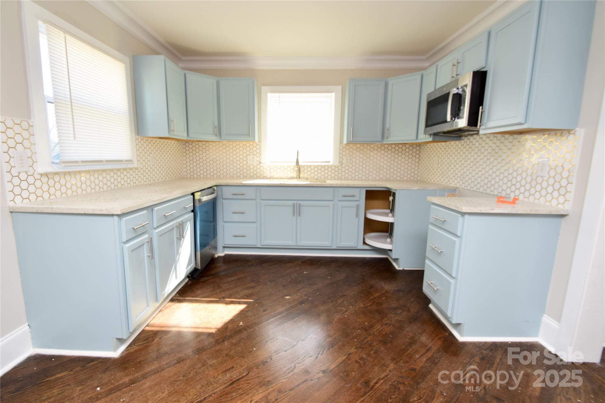 506 East Ridge Street Kings Mountain, NC 28086 - Photo 9 of 23 a kitchen with stainless steel appliances a stove a sink and a microwave