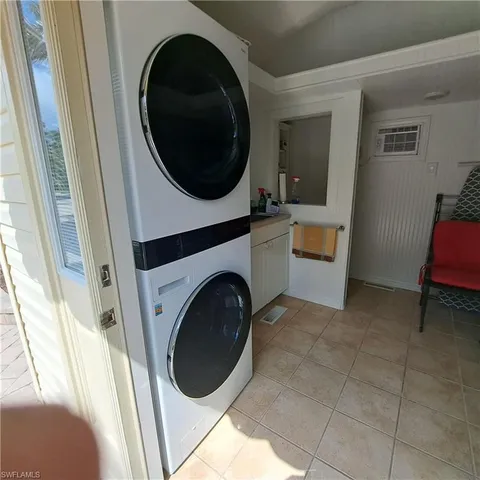 a view of a hallway with washer and dryer