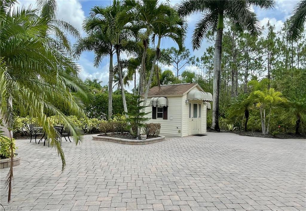 4928 Coach Lane Naples, FL 34114 - Photo 4 of 20 a view of a house with a patio