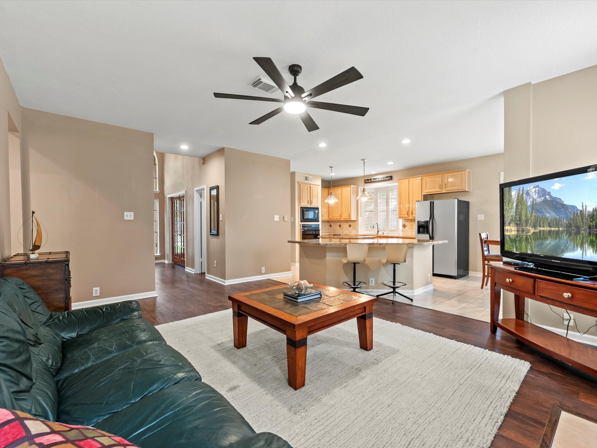 911 Chinni Court Houston, TX 77094 - Photo 12 of 31 a living room with furniture and a flat screen tv