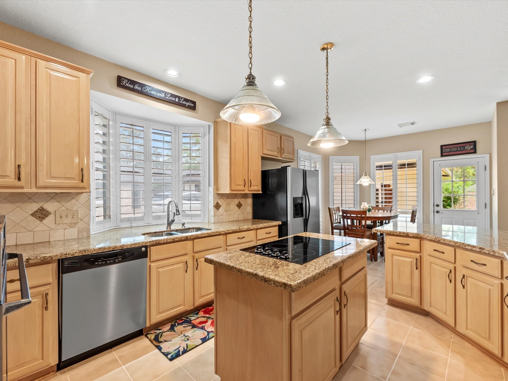 911 Chinni Court Houston, TX 77094 - Photo 15 of 31 a kitchen with a sink stove and cabinets