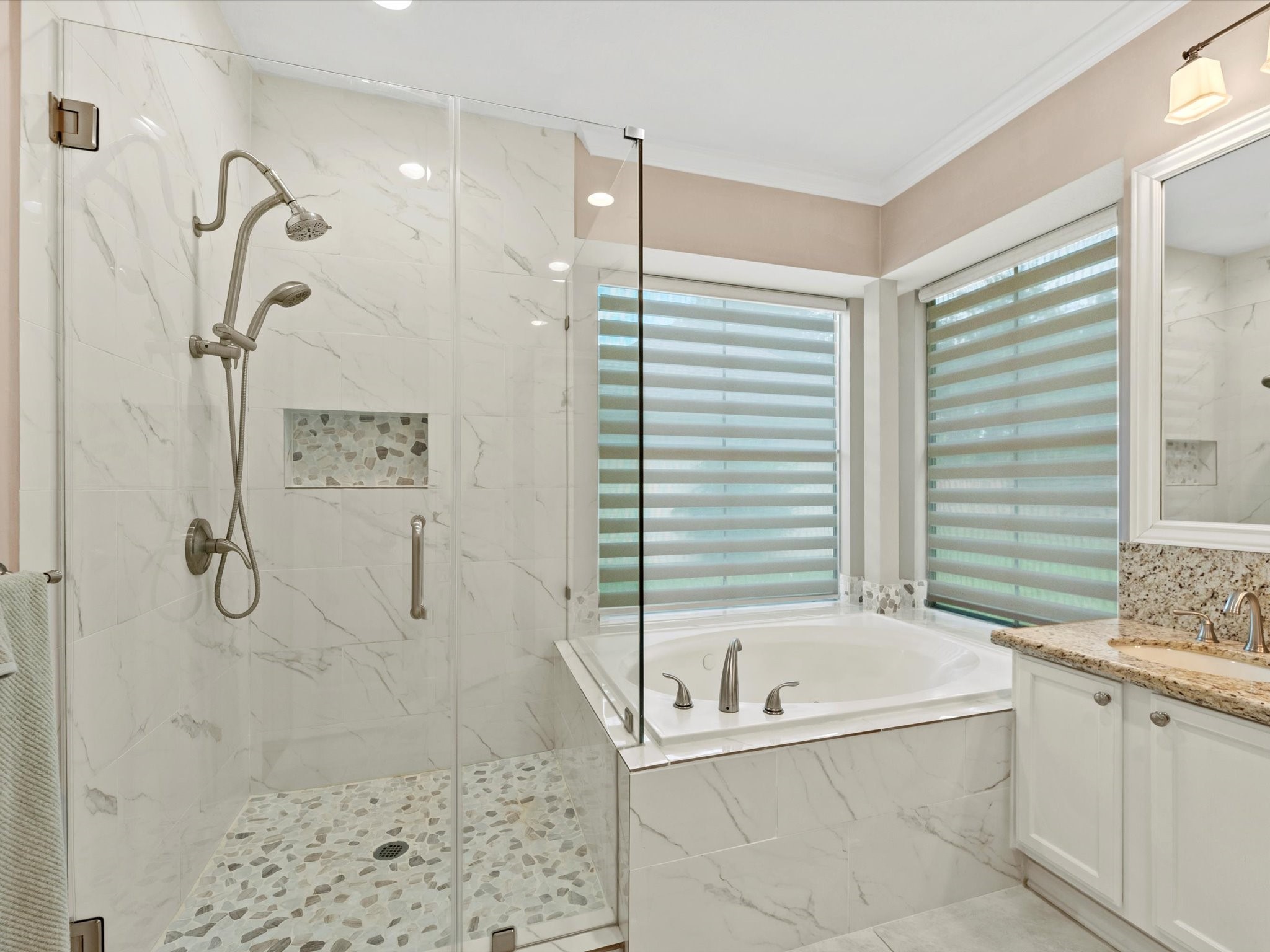 911 Chinni Court Houston, TX 77094 - Photo 21 of 31 a bathroom with a bathtub a shower and a shower