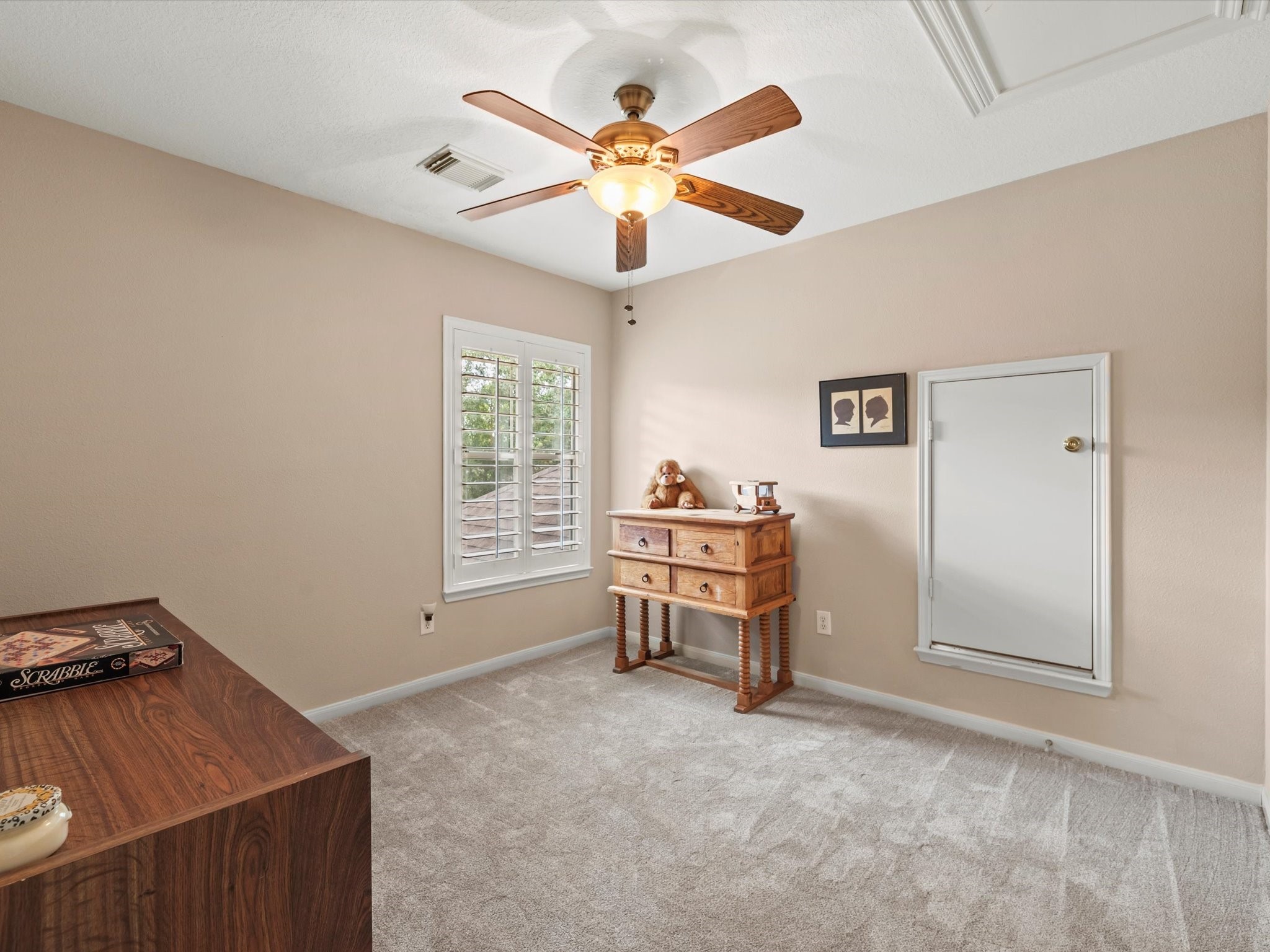911 Chinni Court Houston, TX 77094 - Photo 28 of 31 a view of a workspace with furniture and a ceiling fan