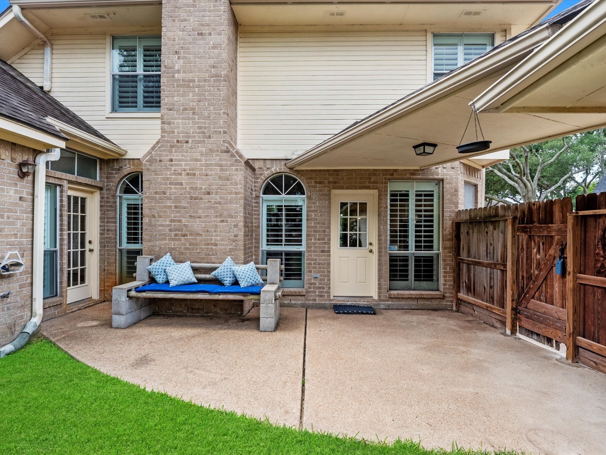 911 Chinni Court Houston, TX 77094 - Photo 30 of 31 a wooden bench sitting in front of a house