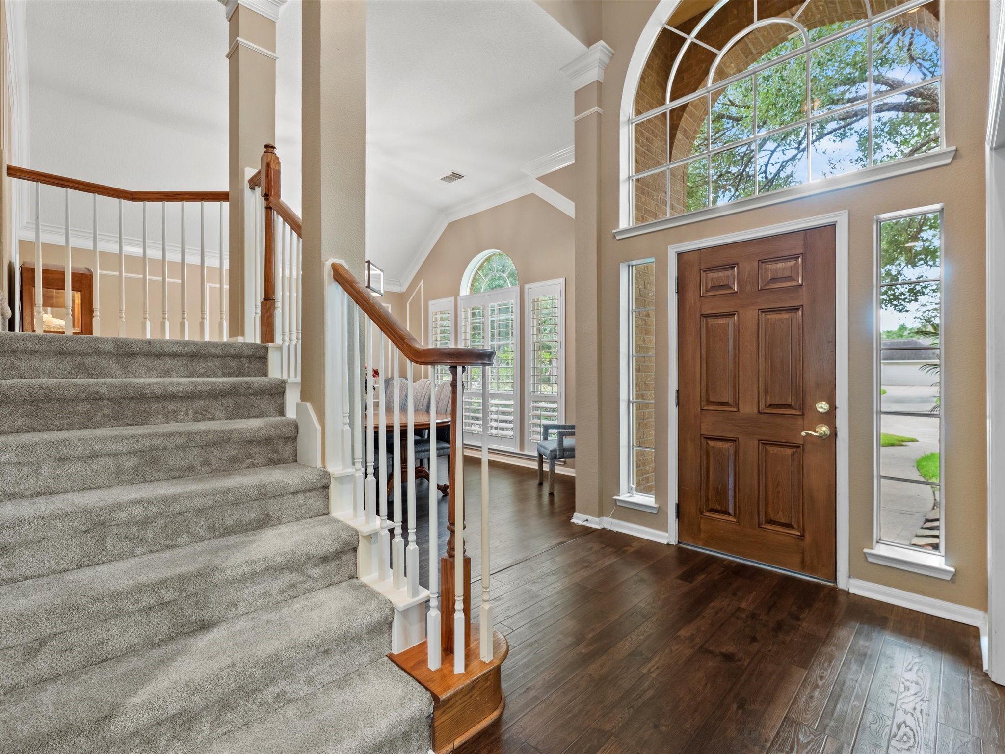 911 Chinni Court Houston, TX 77094 - Photo 5 of 31 a view of front door with wooden floor and stairs