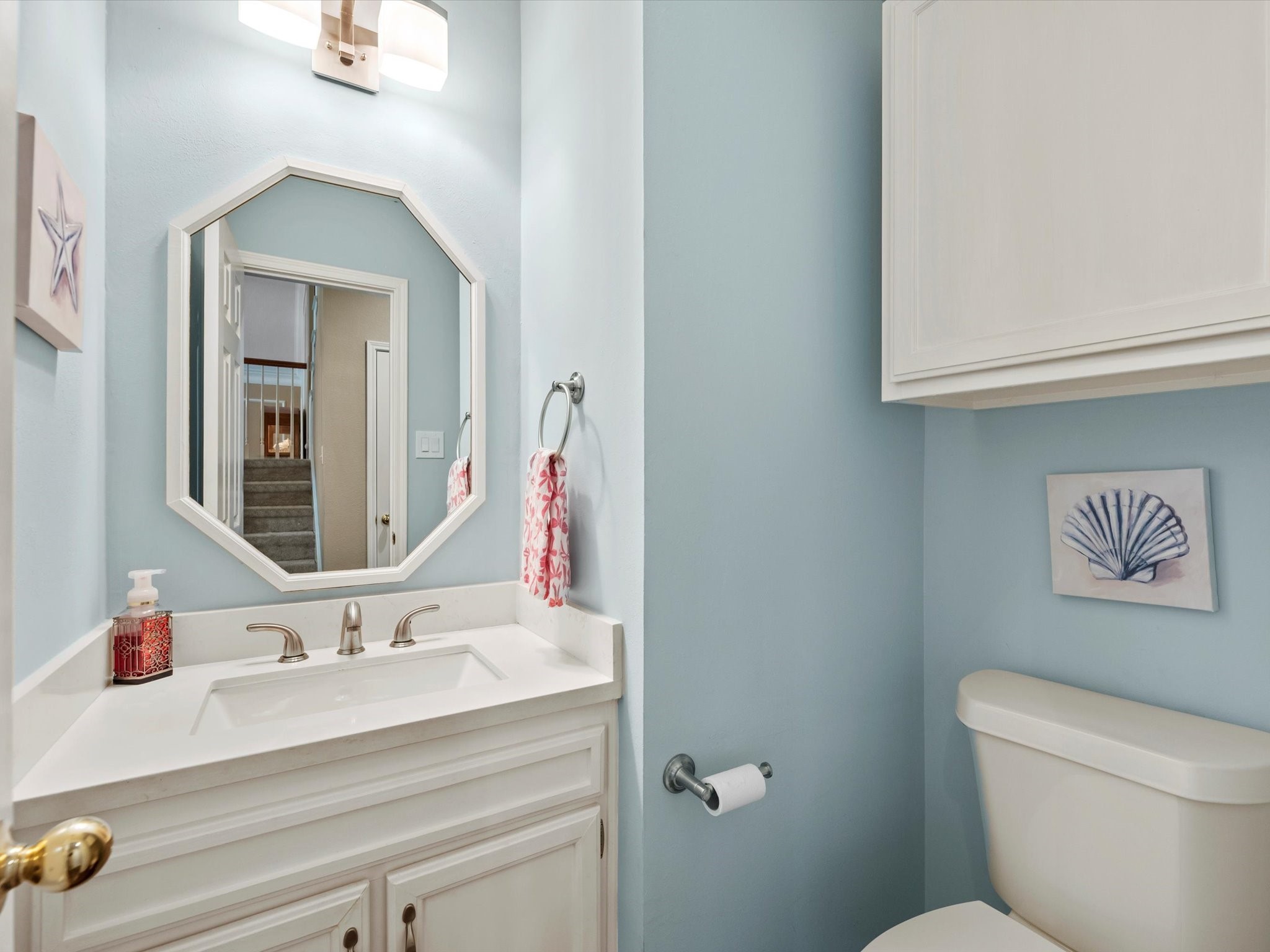 911 Chinni Court Houston, TX 77094 - Photo 9 of 31 a bathroom with a sink vanity mirror and toilet