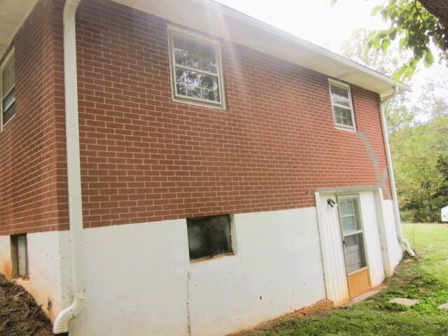 4043 Henry Road Ferrum, VA 24088 - Photo 2 of 14 a view of a brick house with a door