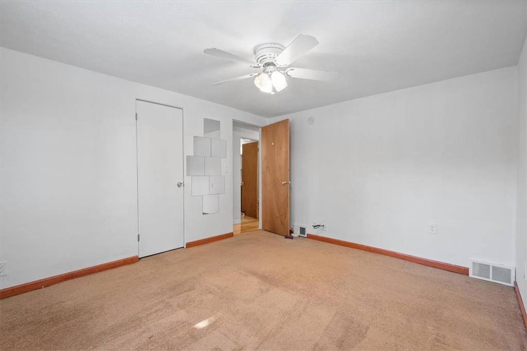 131 Ridgewood Road Coraopolis, PA 15108 - Photo 17 of 39 a view of an empty room with a ceiling fan