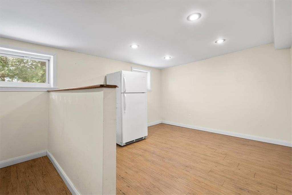 131 Ridgewood Road Coraopolis, PA 15108 - Photo 25 of 39 a view of an empty room with wooden floor and a window
