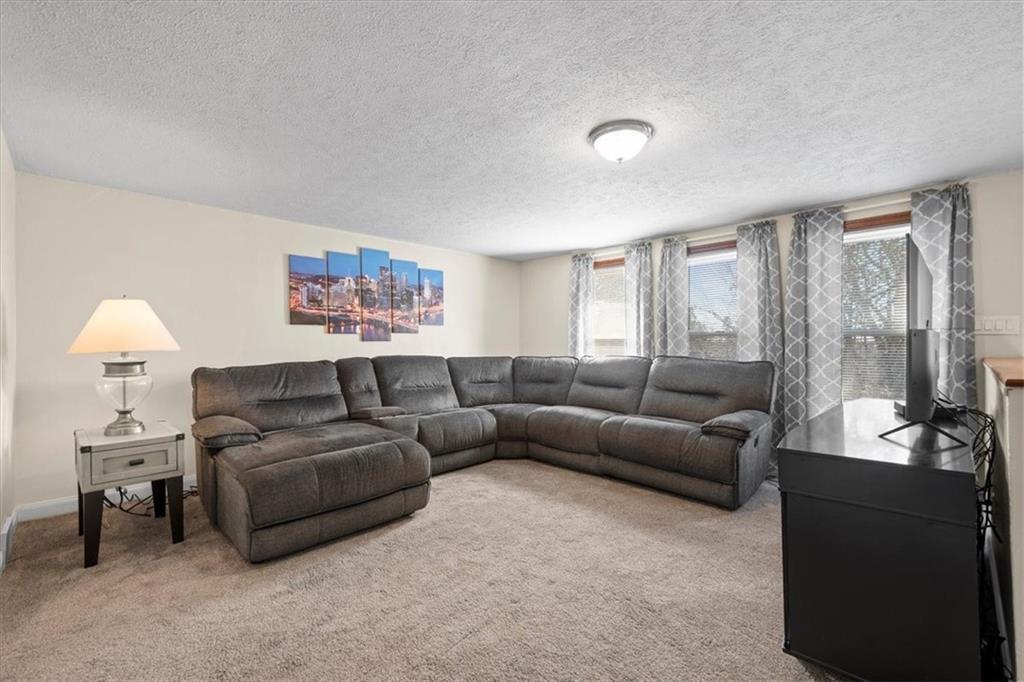 131 Ridgewood Road Coraopolis, PA 15108 - Photo 8 of 39 a living room with furniture and a large window