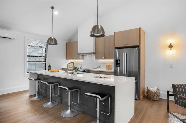 a dining room with stainless steel appliances
