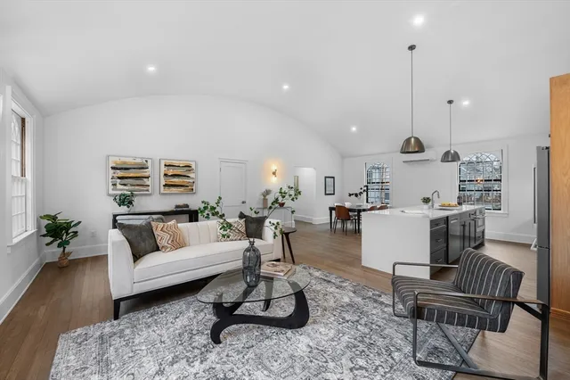 a bedroom with a bed table and a window