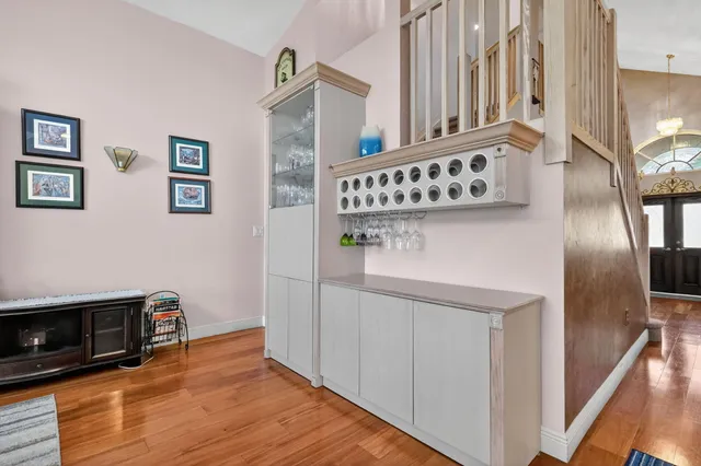 a view of an entryway with wooden floor