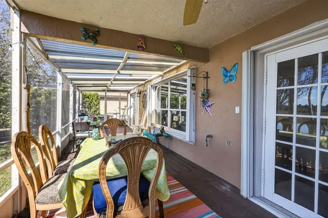 a very nice looking room with a large window and furniture