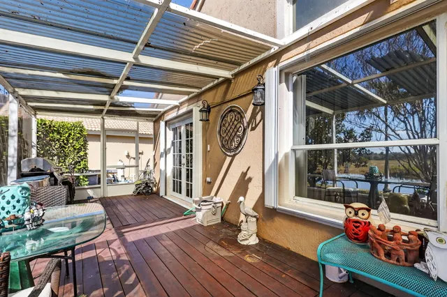 a outdoor space with lots of furniture and wooden floor