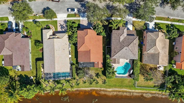 an aerial view of multiple houses with yard
