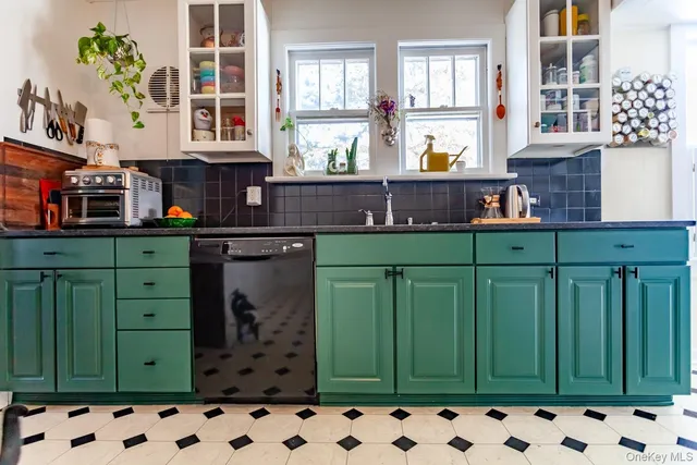 a kitchen with cabinets and a wooden floor
