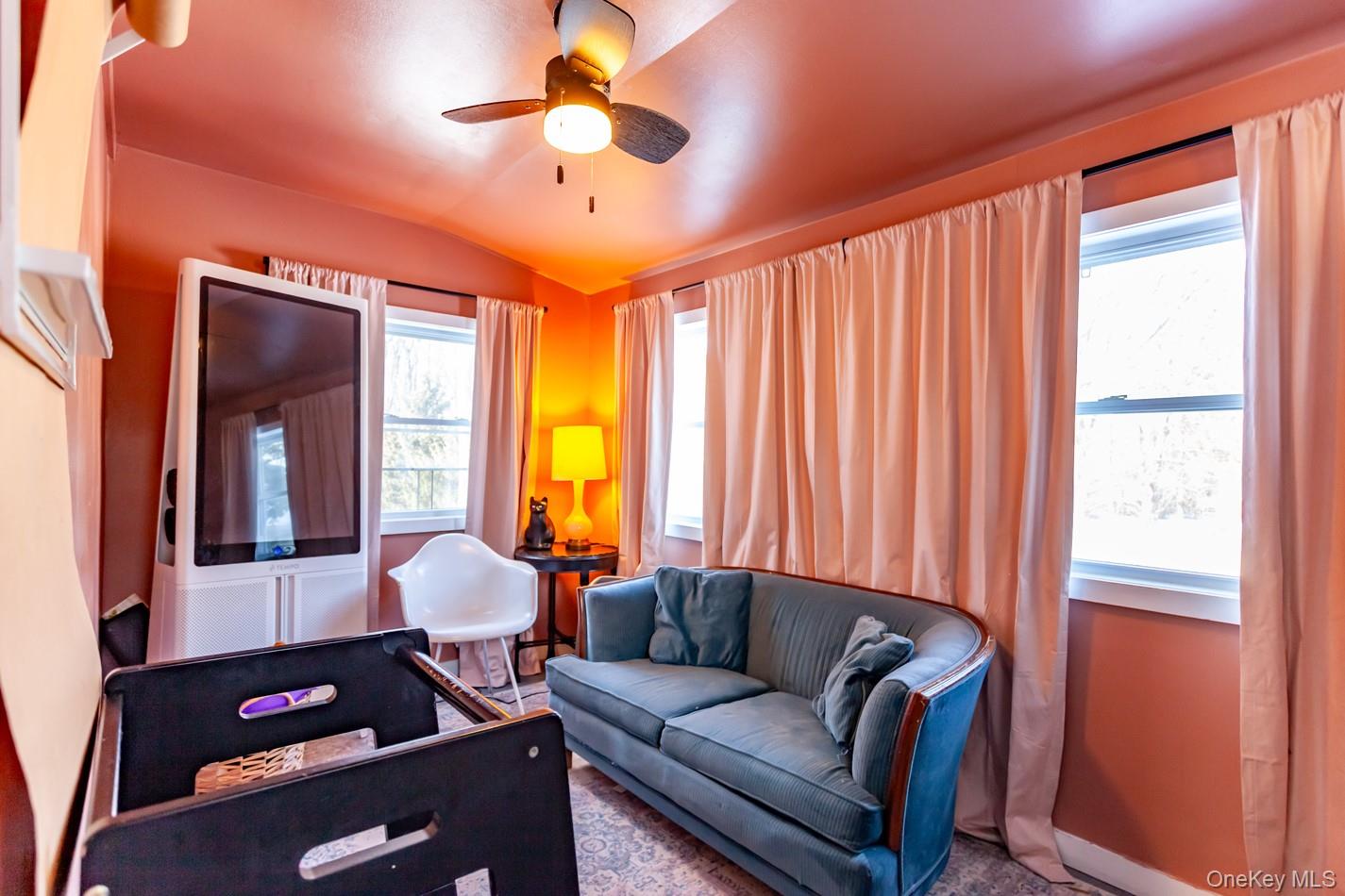 1710 Highway 9D Cold Spring, NY 10516 - Photo 15 of 41 Living room featuring vaulted ceiling and a ceiling fan