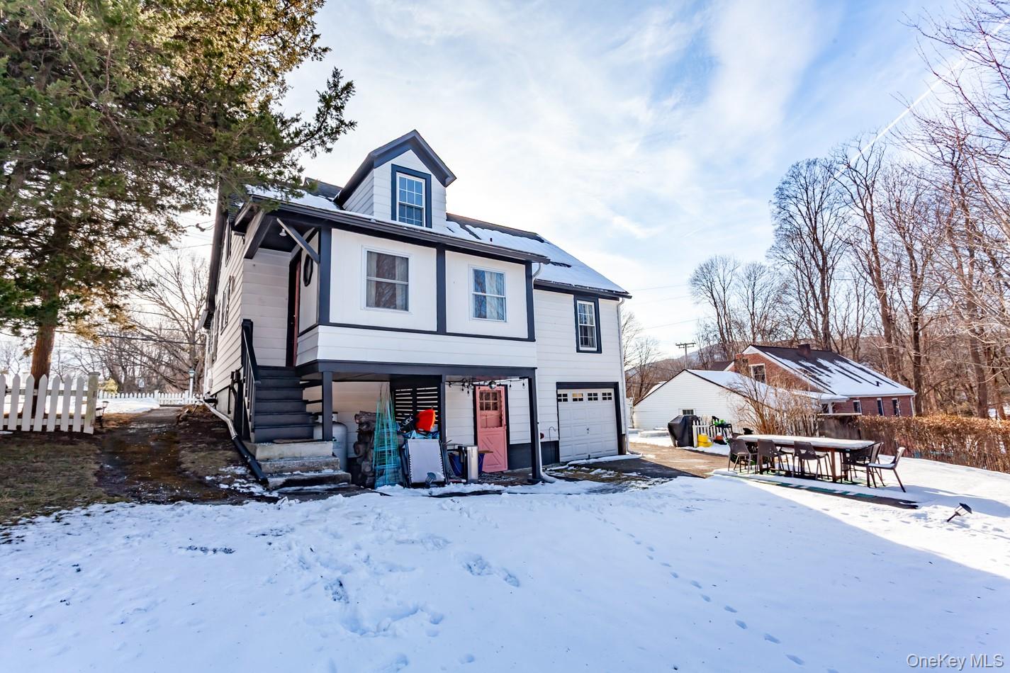 1710 Highway 9D Cold Spring, NY 10516 - Photo 35 of 41 View of front facade with an attached garage and a patio area