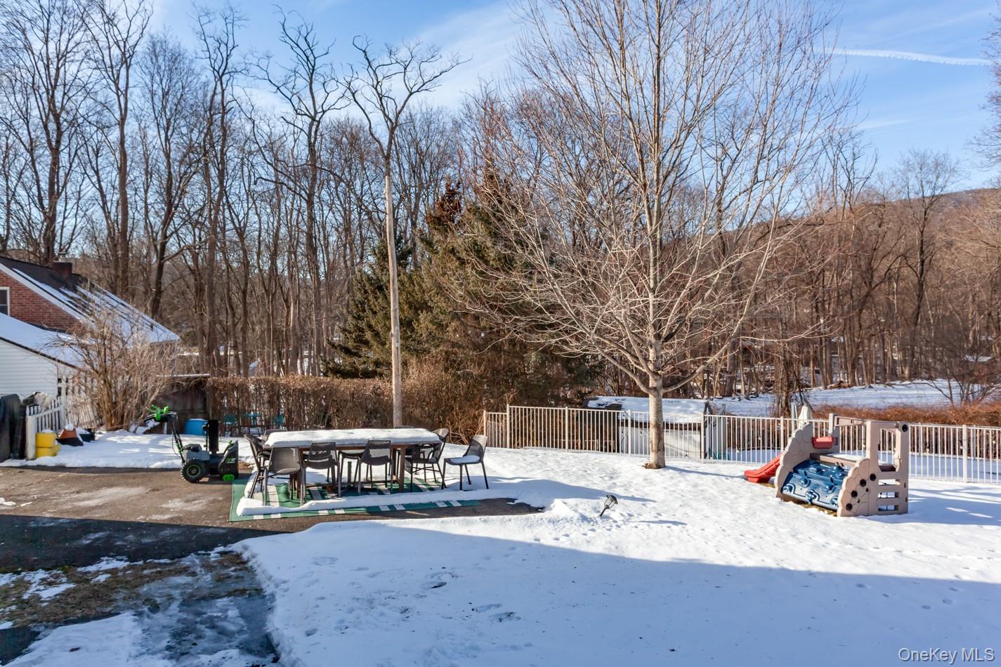 1710 Highway 9D Cold Spring, NY 10516 - Photo 36 of 41 Snowy yard with a fenced backyard and outdoor dining area