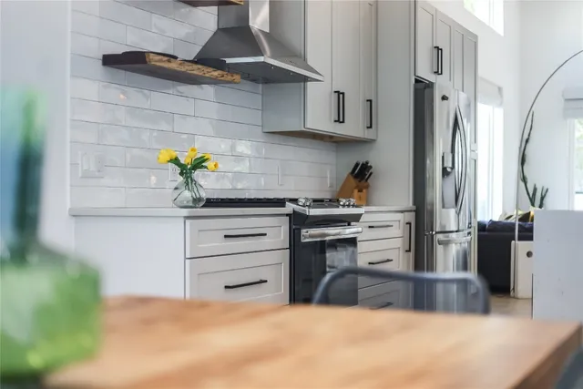 a bedroom with furniture and a flat screen tv