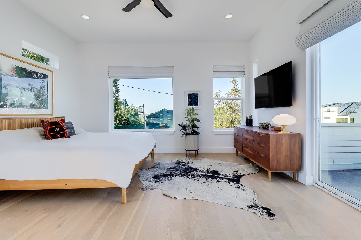 4712 Reyes Street, Unit 1 Austin, TX 78721 - Photo 20 of 40 a living room with furniture and a flat screen tv