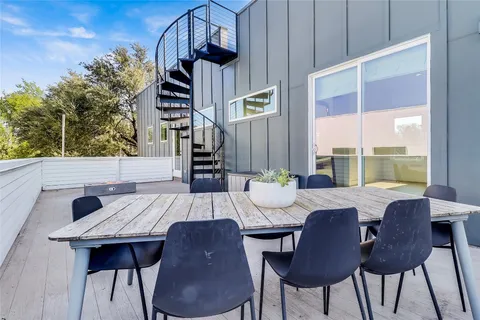 a bedroom with a bed and large window