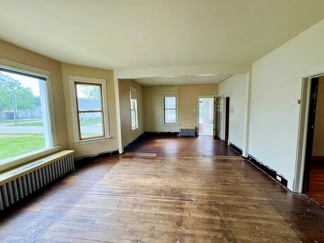 a view of an empty room with glass door