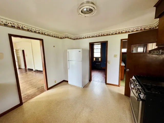 a view of a livingroom with furniture and staircase